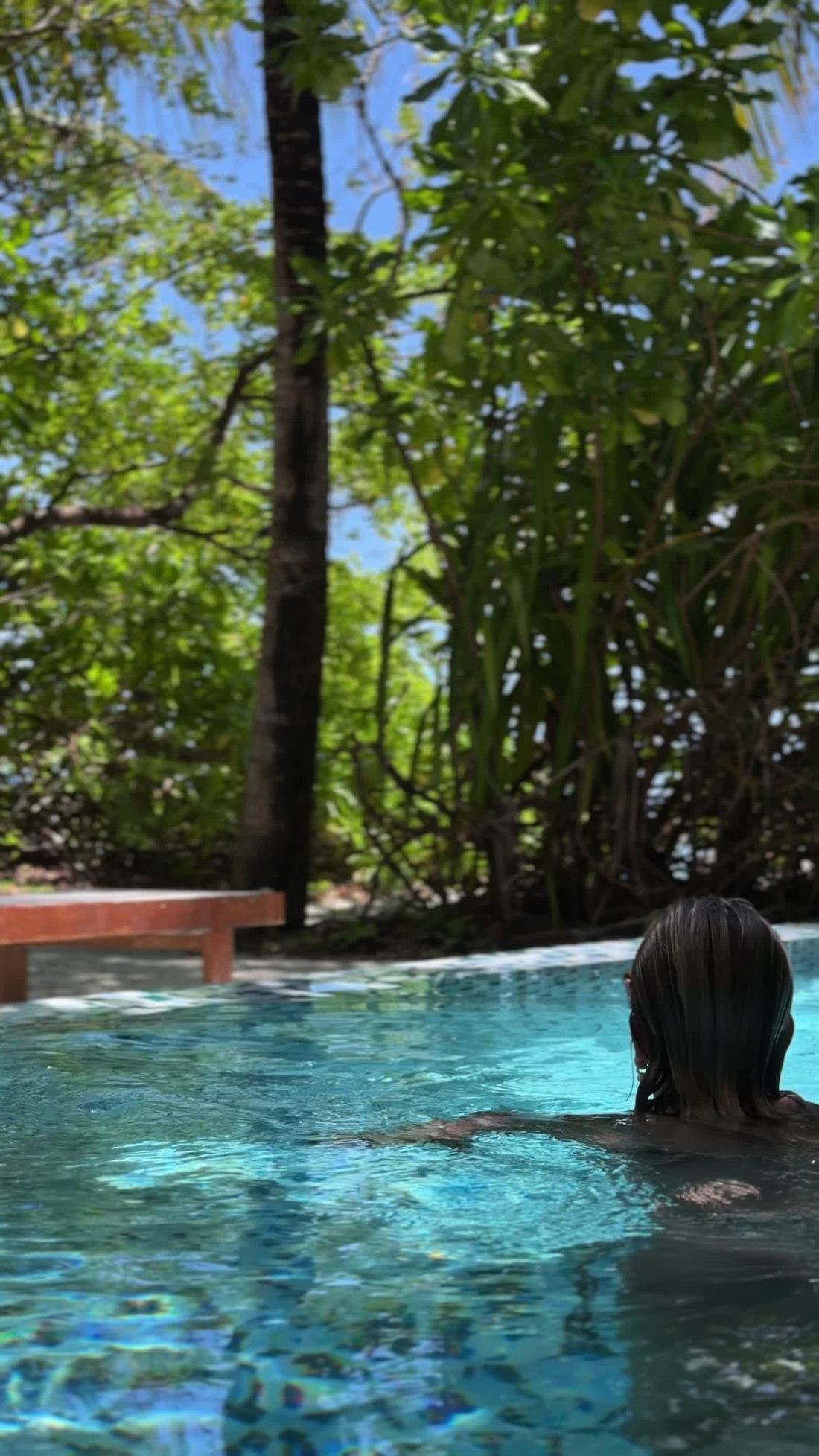 Resort guests enjoying a private pool